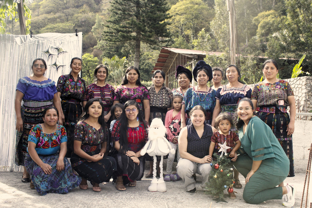 Guatemalan artisans and Friendship Bridge staff gathering together