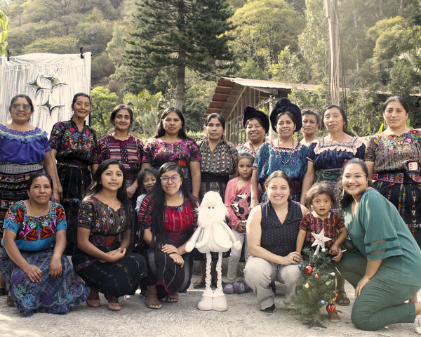 Guatemalan artisans and Friendship Bridge staff gathering together